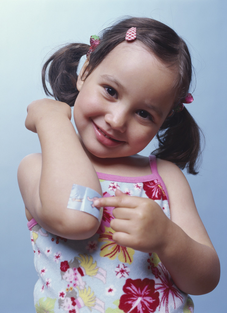 Girl with bandaid on elbow